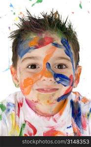 Beautiful toddler boy covered in bright paint.