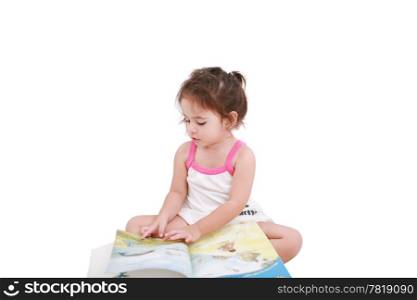 Beautiful toddler girl reading a book
