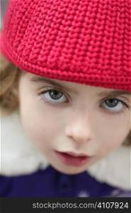 beautiful toddler girl winter wool hat portrait in outdoors