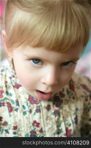 Beautiful toddler little girl with funny angry gesture expression