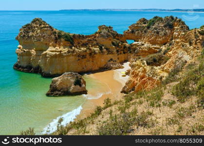 Beautiful top view on sandy beach Dos Tres Irmaos (Portimao, Alvor, Algarve, Portugal).