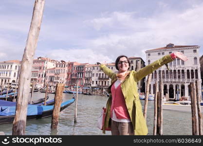 Beautiful tourist woman in Venice, exploring the old city