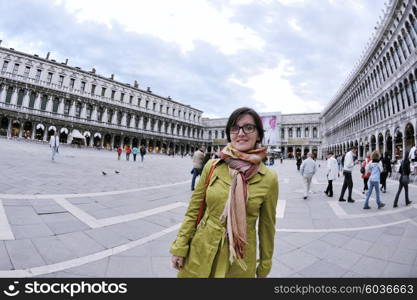 Beautiful tourist woman in Venice, exploring the old city