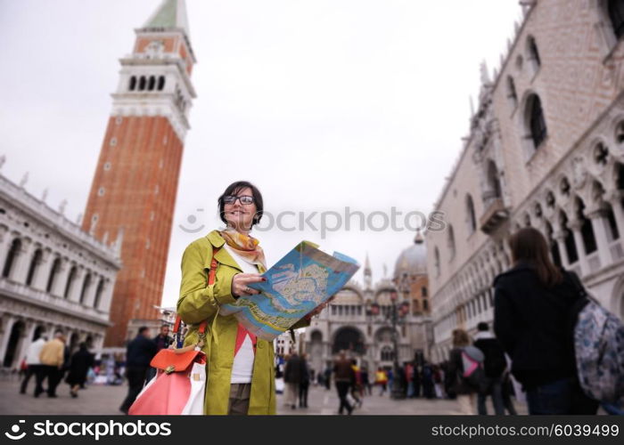 Beautiful tourist woman in Venice, exploring the old city