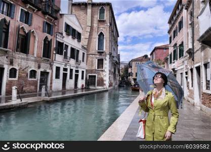 Beautiful tourist woman in Venice, exploring the old city