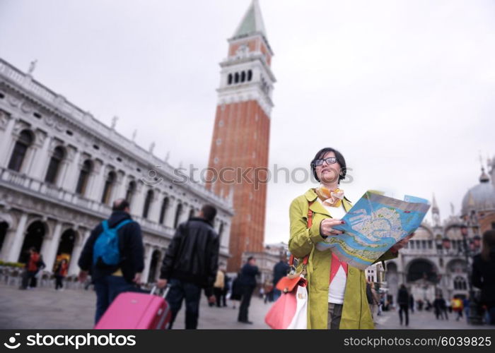 Beautiful tourist woman in Venice, exploring the old city