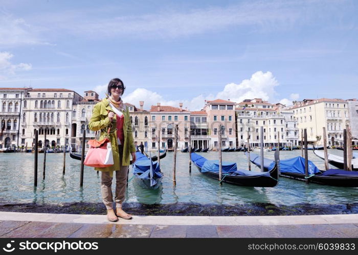 Beautiful tourist woman in Venice, exploring the old city