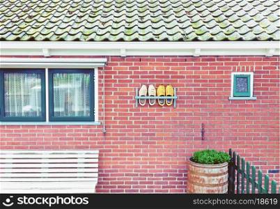 Beautiful traditional house facade in a Netherlands with tradition shoes