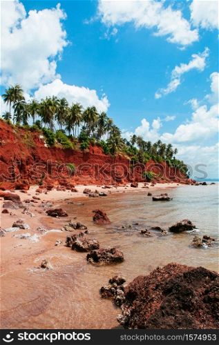 Beautiful tranquil tropical island red cliff rock beach with blue sky and clouds in summer, tranquil serene ocean scenery. Fang Daeng in Prachuap Khiri Khan. Thailand
