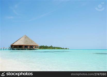 beautiful tropical beach and wooden bungalow in Maldives