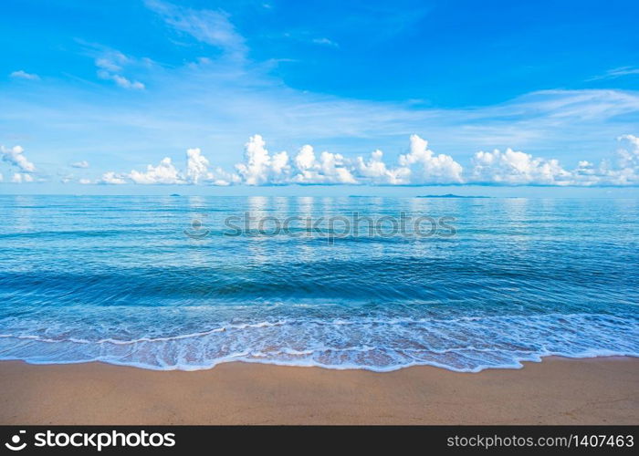 Beautiful tropical beach sea ocean with white cloud blue sky and copyspace for leisure travel in holiday vacation concept