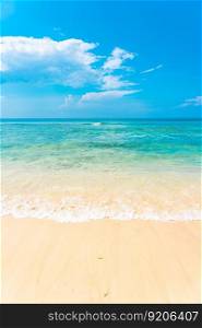 Beautiful tropical empty beach sea ocean with white cloud on blue sky background for leisure travel vacation