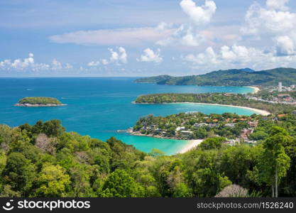 Beautiful turquoise ocean waves with boats and coastline from high view point. Kata and Karon beaches Phuket Thailand
