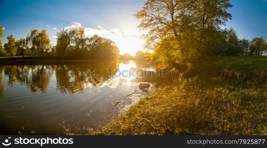 Beautiful ukrainian landscape of forest and river at sunset