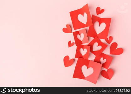 Beautiful valentines day paper hearts on pink background. View from above. Valentines Day Concept. 