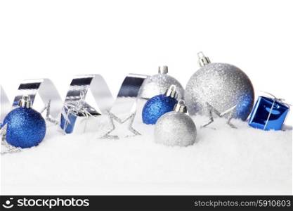 Beautiful various blue and silver christmas decor on snow close-up