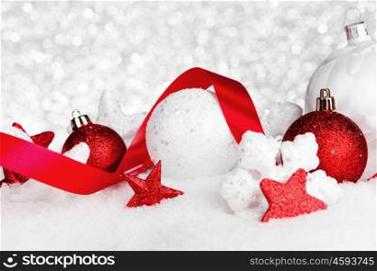 Beautiful various christmas decor on snow close-up