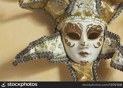 Beautiful Venetian Mask on Light Yellow Wall