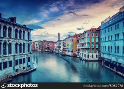 Beautiful Venice city in overcast weather, wonderful water channel between gorgeous colorful medieval buildings, interesting travel to Italy concept