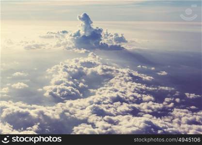 Beautiful view above clouds from the aircraft