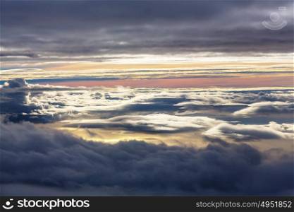 Beautiful view above clouds from the aircraft