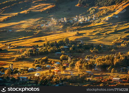 Beautiful view from Svaneti, Sunset rays and golden light, evening time, fog and castles in old village. Mestia, Mulakhi.