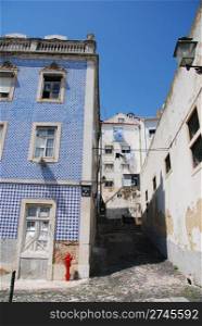 beautiful view of a almost abandoned street at Alfama district in Lisbon, Portugal