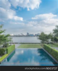 Beautiful view of abstract blurred riverside swimming pool with cityscape background