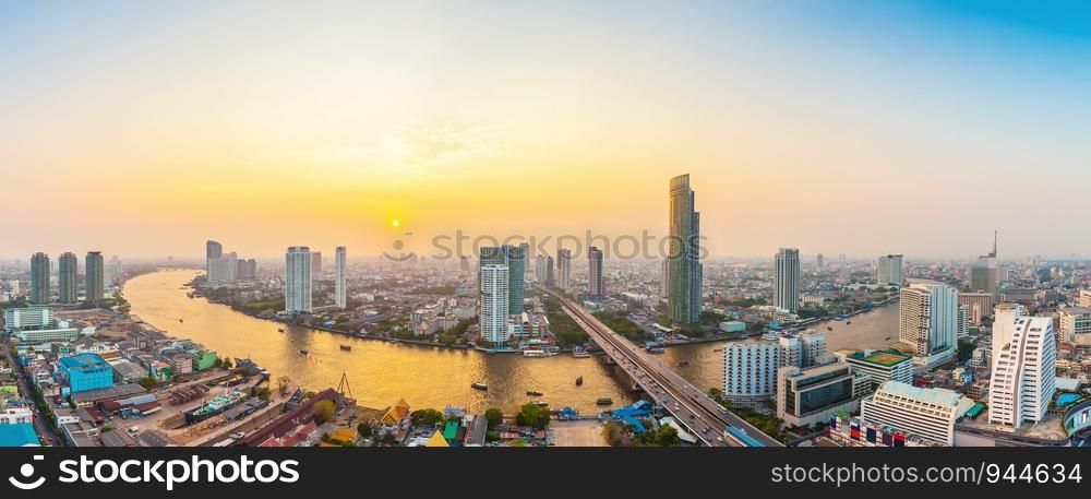Beautiful view of Bangkok city with Chaopraya river at sunset. Panorama photo.