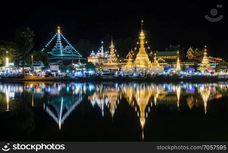 Beautiful view of Burmese style temples with reflection on lake,   Wat Chong Klang and Wat Chong Kham in Mae Hong Son, Thailand