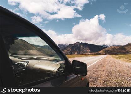 beautiful view of car on the background of Altai mountain valley. Altai mountains landscape.. beautiful view of car on the background of Altai mountain valley. Altai mountains landscape