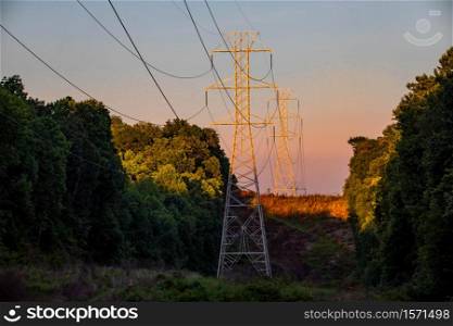 Beautiful view of electrical tower silhouette at country sunset rural. Beautiful view of electrical tower silhouette at country sunset