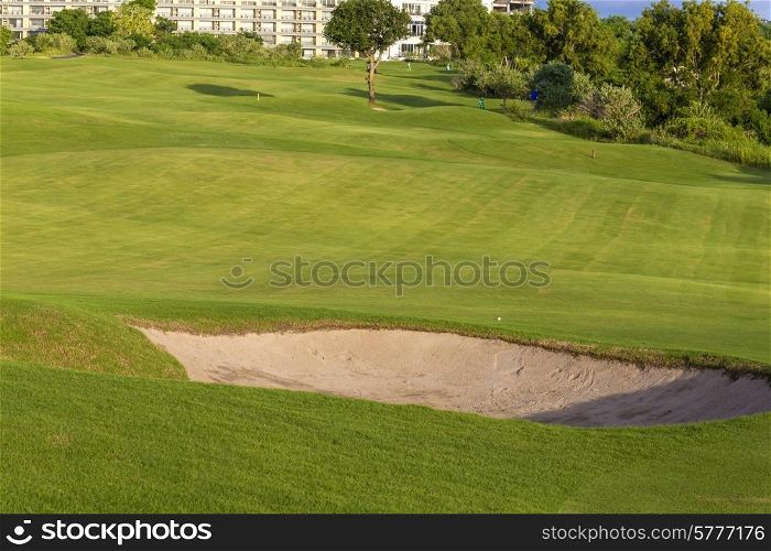 Beautiful View of Green Golf Field with Blue Sky.