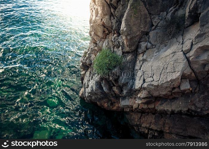 Beautiful view of high cliff in deep blue sea