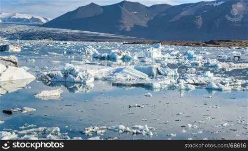 Beautiful view of icebergs in Jokulsarlon glacier lagoon, Iceland, global warming concept, selective focus