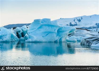 Beautiful view of icebergs in Jokulsarlon glacier lagoon, Iceland; selective focus