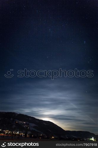 Beautiful view of mountain silhouette against starry nigh sky and shining moon
