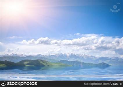 Beautiful view of mountains with sunny sea and cloudy blue sky. mountains, sea and cloudy blue sky