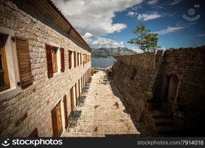 Beautiful view of old narrow street at mediterranean seaside city