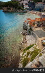 Beautiful view of seaside old castle at city Budva located on high cliff