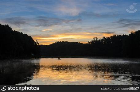 Beautiful view of sunrise over mountain range and lake at Pang Oung national park in Mae Hong Son, Thailand