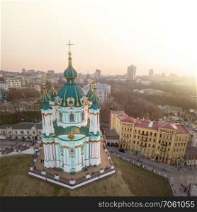 Beautiful view of the ancient street Andrew&rsquo;s Descent and the St. Andrew&rsquo;s Church in Kiev city, Ukraine. Drone photo. Famous saint Andrew&rsquo;s church and panorama of Kiev, Ukraine