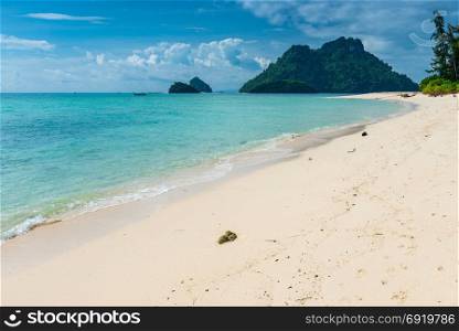 beautiful view of the beach Poda island in Thailand and green rocks in the sea