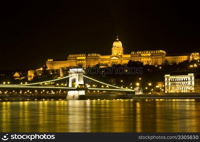beautiful view of the castle and the chain bridge in Budapest at night