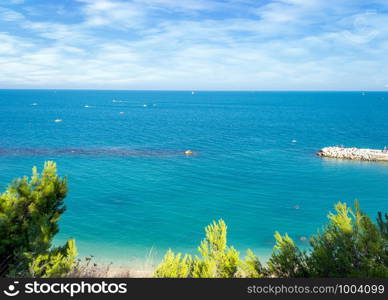 beautiful view of the Sirolo in italy. Aerial view of the famous beach of Sirolo in a sunny day in summertime with scattered clouds