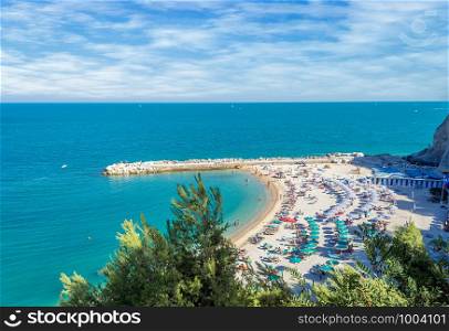beautiful view of the Sirolo in italy. Aerial view of the famous beach of Sirolo in a sunny day in summertime with scattered clouds