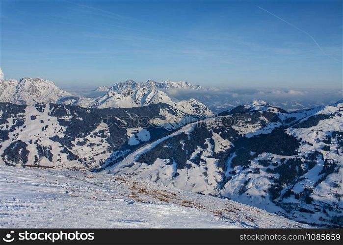 Beautiful view of the snowy mountains, winter sport. Panorama of the Austrian ski resort of Saalbach-Hinterglemm , Austria. Beautiful view of the snowy mountains, winter sport.