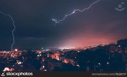 Beautiful view on lightning over city at night, beauty and danger of nature, summer time weather in Beirut, Lebanon