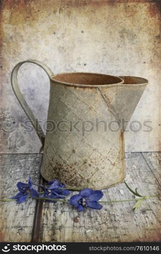 Beautiful vintage look applied to romantic flower and garden paraphenalia still life image with Spring and Summer seasonal blooms