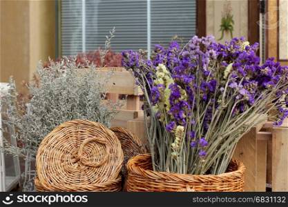 beautiful violet dry flowers bouquet in basket